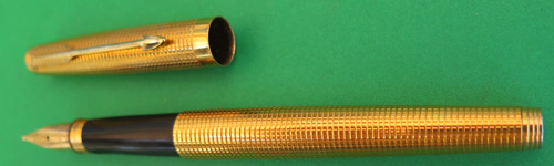 GOLD PLATED PARKER 75 WITH SAME SMALL SQUARE PATTERN AS THE STERLING CISELE. BROAD/MEDIUM NIB